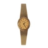 A TISSOT 14CT GOLD LADY'S BRACELET WATCH