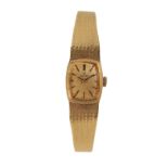 AN OMEGA 18CT GOLD LADY'S BRACELET WATCH