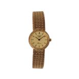 LONGINES: A 9CT GOLD LADY'S BRACELET WATCH