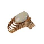 AN OPAL AND GOLD MODERNIST RING