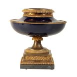 A LOUIS XVI GILT-BRONZE-MOUNTED BLEU NOUVEAU PORCELAIN VASE A MONTER