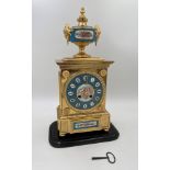 A GILT METAL AND PORCELAIN MOUNTED MANTEL CLOCK Of LOUIS XVI STYLE