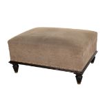 AN EBONISED AND UPHOLSTERED LOW STOOL,