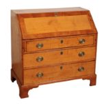 A GEORGE III SATINWOOD BUREAU