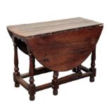 AN 18TH CENTURY OAK GATELEG TABLE