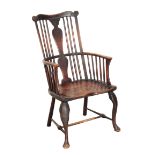 A GEORGE II 'THAMES VALLEY' ELM AND ASH 'COMB' BACK WINDSOR ARMCHAIR