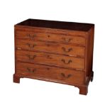 A GEORGE III MAHOGANY CADDY-TOP CHEST OF DRAWERS