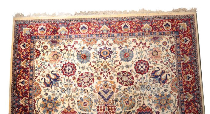 A LARGE PERSIAN STYLE RUG