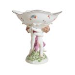 A MEISSEN CENTRE PIECE WITH ENTWINED PUTTI