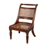 AN ANGLO-INDIAN ROSEWOOD BERGERE SIDE CHAIR