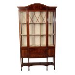 AN EDWARDIAN MAHOGANY BREAKFRONT DISPLAY CABINET