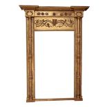 A REGENCY GILTWOOD AND COMPOSITION OVERMANTEL MIRROR,