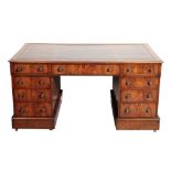 AN EARLY 19TH CENTURY WALNUT PEDESTAL DESK