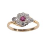 A RUBY AND DIAMOND DAISY CLUSTER RING