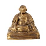 A CHINESE GILT BRONZE OF A MONK