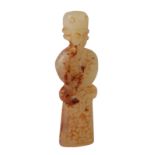A CHINESE PALE CELADON JADE FIGURE OF AN OFFICIAL