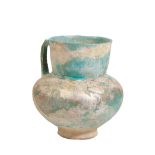 A KASHAN TURQUOISE-GLAZE EWER, Possibly 12th Century