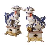 A PAIR OF CHINESE STYLE POTTERY BUDDHISTIC DOGS OF FO