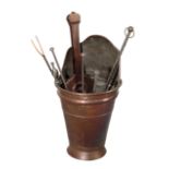 A COPPER COAL BUCKET WITH FIRE IRONS