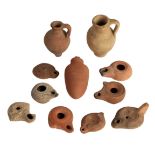 A COLLECTION OF ROMAN AND OTHER OIL LAMPS
