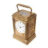 A VICTORIAN GILT BRASS REPEATING CARRIAGE CLOCK