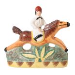 A STAFFORDSHIRE FLATBACK FIGURE OF A JOCKEY