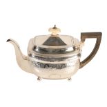 A GEORGE III SILVER TEA POT