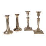 A PAIR OF SILVER CANDLESTICKS