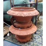 A PAIR OF VICTORIAN TERRACOTTA GARDEN URN TOP SECTIONS (ONLY)
