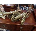 A PAIR OF DECORATIVE CAST BRASS MINIATURE CANNON