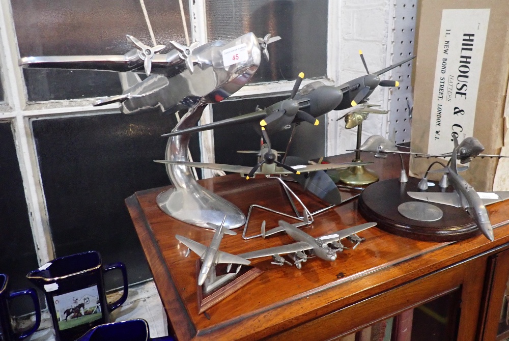 A CAST METAL MODEL OF A FOUR PROPELLER PLANE