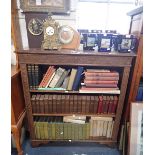 A VICTORIAN CARVED OAK OPEN BOOKCASE