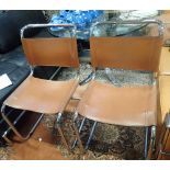 A PAIR OF TUBULAR STEEL CANTILEVER CHAIRS