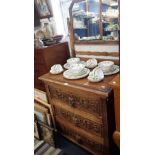 A VICTORIAN CARVED OAK CHEST OF DRAWERS