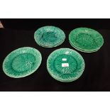 A COLLECTION OF WEDGWOOD AND OTHER GREEN GLAZED LEAF PLATES
