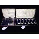 A SET OF TWELVE SILVER TEASPOONS