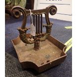 A CAST IRON 'LYRE' BOOTSCRAPER,