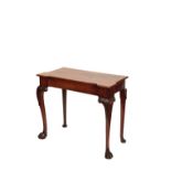 A GEORGE II STYLE MAHOGANY SIDE TABLE
