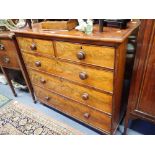 A VICTORIAN FIGURED MAHOGANY CHEST OF DRAWERS