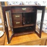 AN EDWARDIAN OAK SMOKER'S CABINET