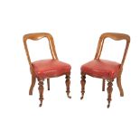 A SET OF FOUR GEORGE IV OR WILLIAM IV OAK AND UPHOLSTERED SIDE CHAIRS