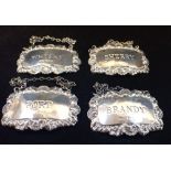 A SET OF FOUR SILVER DRINKS LABELS