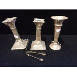 A PAIR OF SILVER CORINITHIAN COLUMN CANDLESTICKS