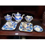 A 19TH CENTURY 'ROCKINGHAM' STYLE PART TEA SET