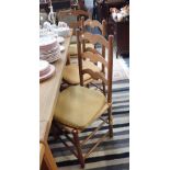 A SET OF EIGHT ARTS AND CRAFTS STYLE LADDERBACK RUSH SEATED ARMCHAIRS