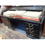 A LARGE EDWARDIAN ROLL-TOP DESK