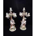 A PAIR OF DRESDEN SHEPHERD AND SHEPHERDESS CANDELABRA