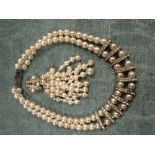A SYNTHETIC PEARL AND PASTE DOUBLE STRAND CHOKER NECKLACE