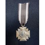 A NAZI 'STYLE' 10 YEAR SERVICE MEDAL