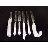 A SET OF SIX SILVER HANDLED TEA KNIVES